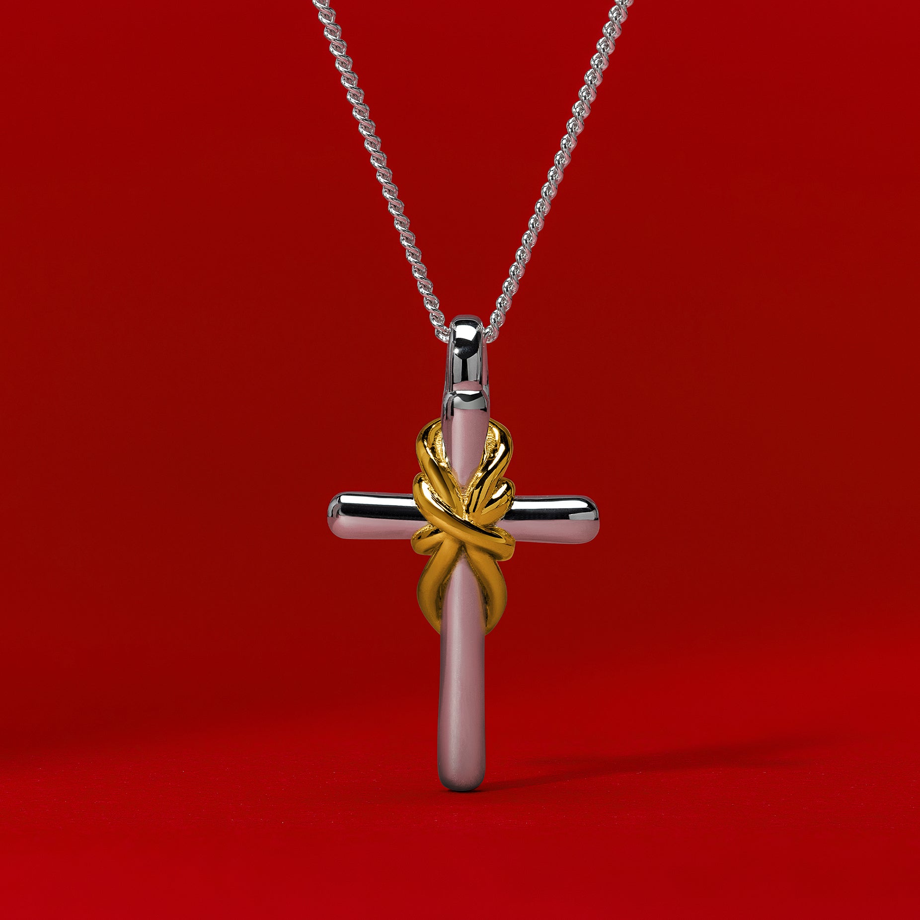 TIED CROSS PENDANT